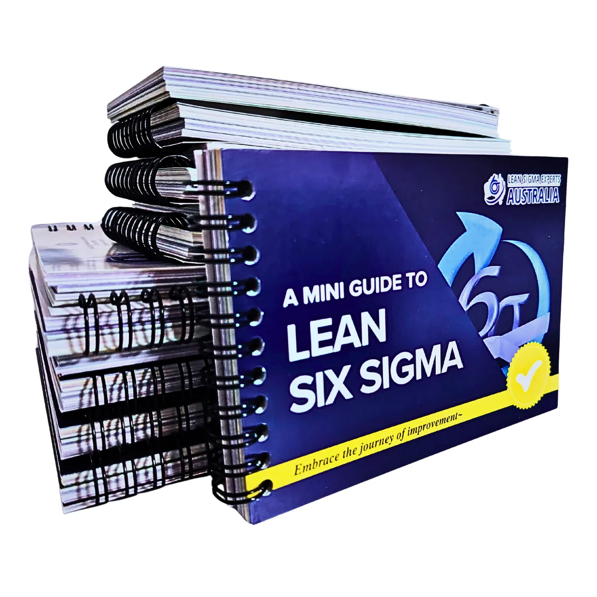 Printed Lean Six Sigma pocket guides stacked behind a front cover